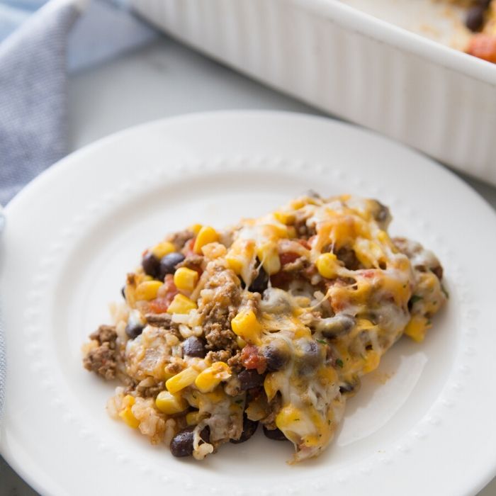 cheesy taco bake on a white plate