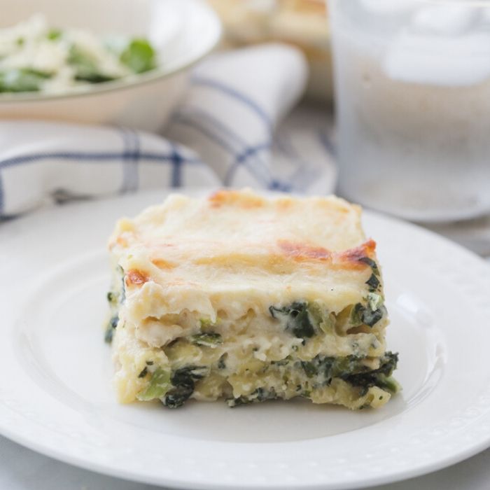 Slice of alfredo chicken lasagna on a plate 