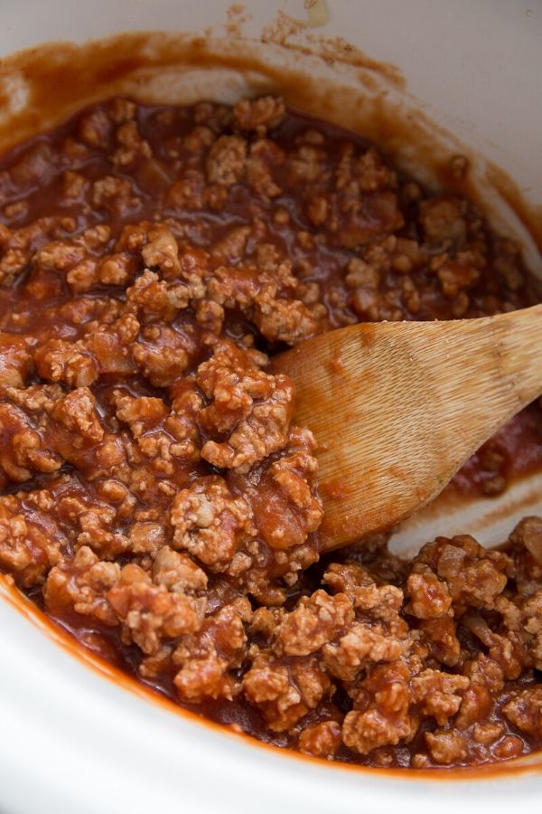 sloppy joe mix with wooden spoon by it 