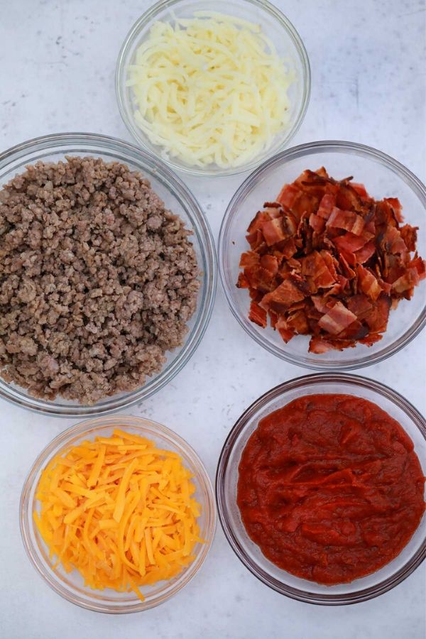 ingredients for pinwheels in bowls on table 