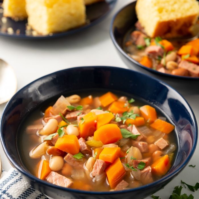 bowl of ham and bean soup with cornbread 