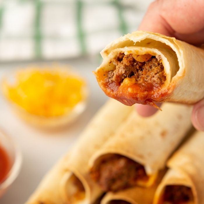 bitten taquito being held 