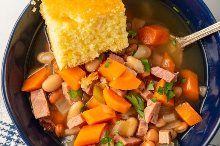 bowl of ham and beans with cornbread