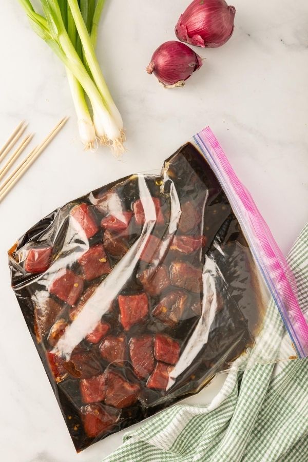 steak in a marinade in sealable bag