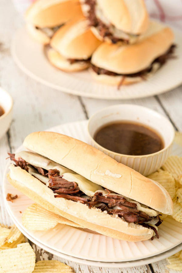 au jus roast beef sandwiches on plates 