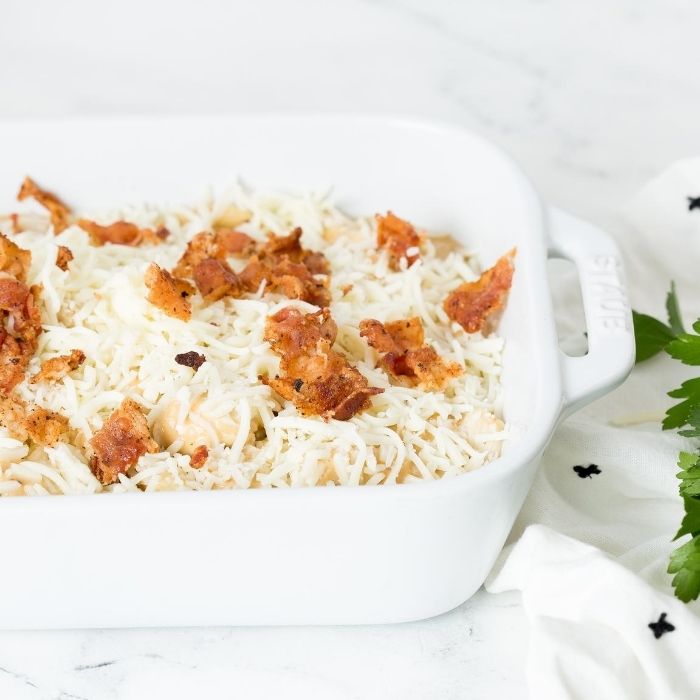 casserole dish with chicken bacon pasta topped with bacon 