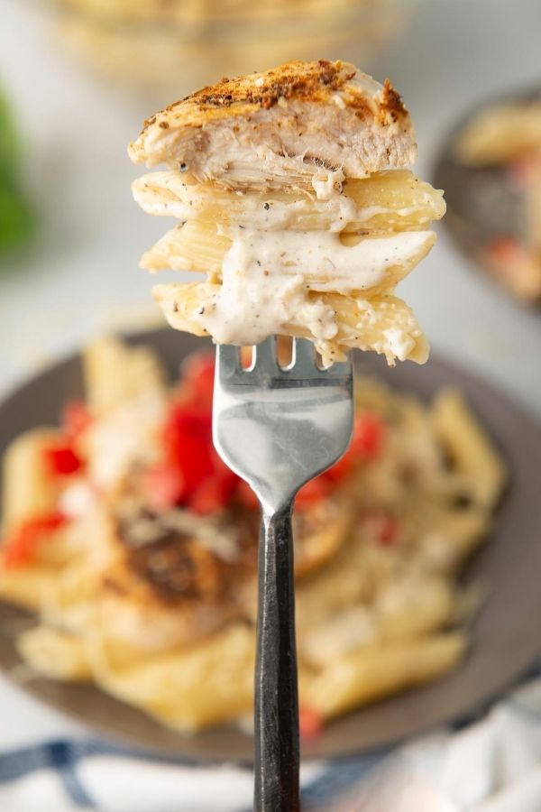 chicken and pasta on a fork 