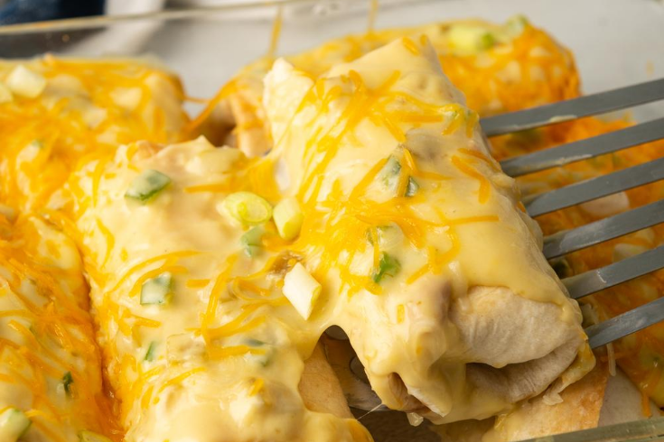 spatula scooping up chicken chimichanga