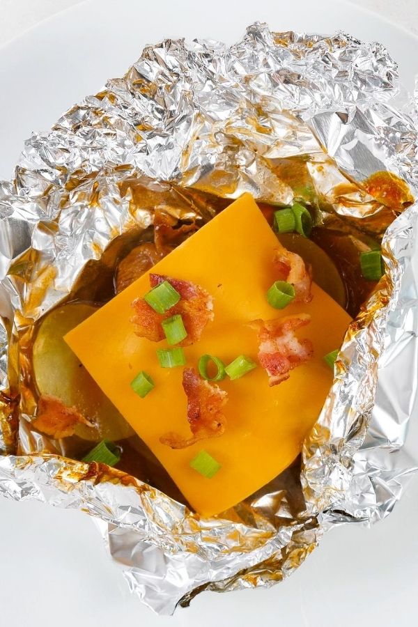 cheese on top of chicken and potatoes