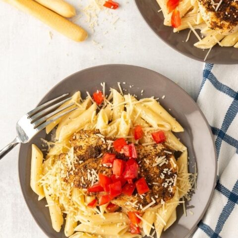 creamy chicken pasta on a brown plate