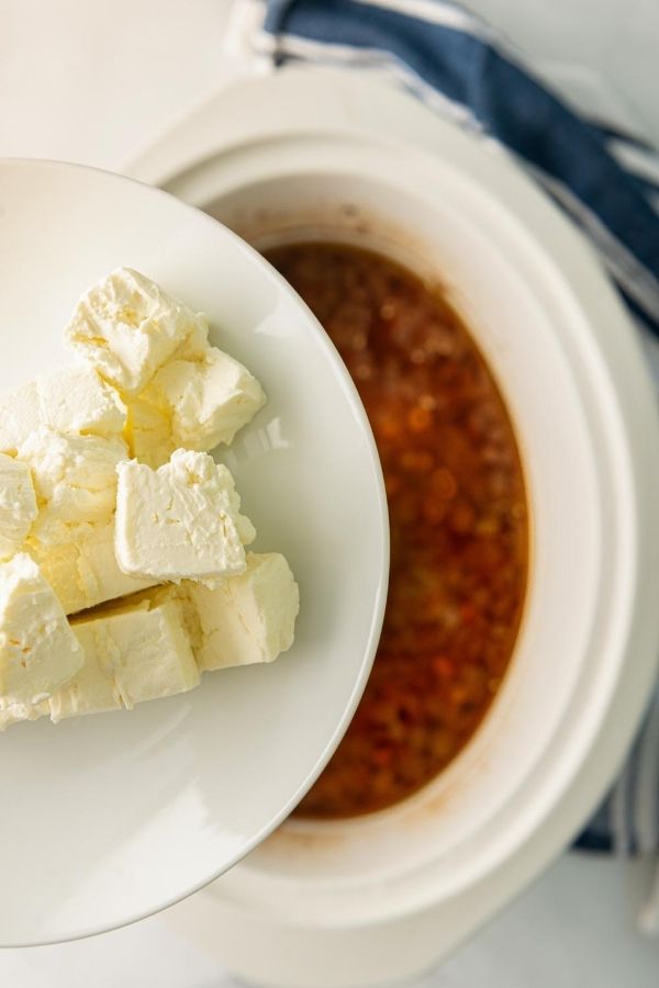cream cheese dumping into slow cooker