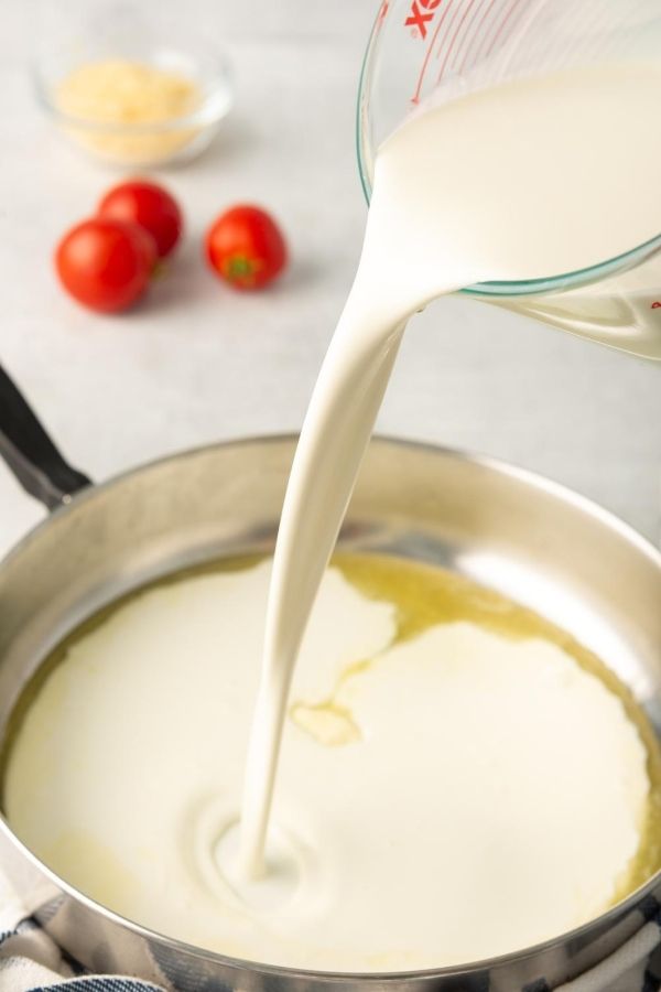 milk pouring into pan 