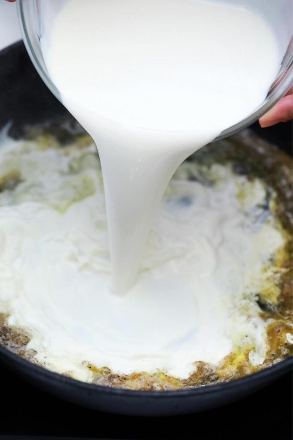 pouring half and half in pan