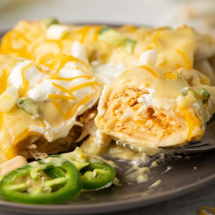 fork with a piece of chicken chimichanga 