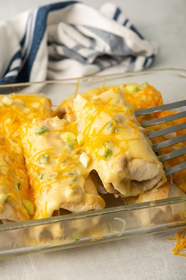 scooping chimichanga from pan