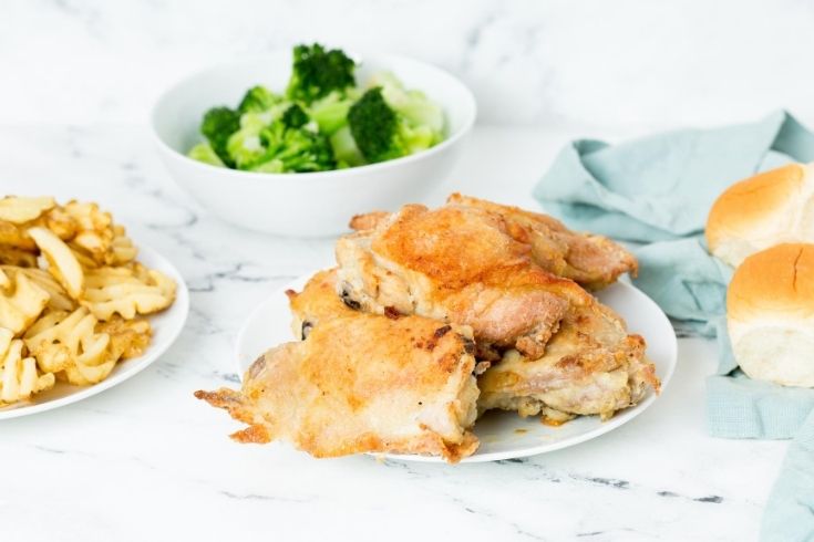 oven fried chicken on a plate with all the fixings