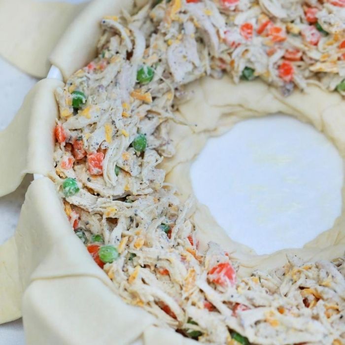 pot pie crescent roll ring, that is raw and waiting to roll up