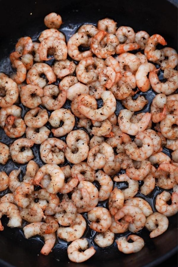 shrimp seasoned in a skillet 