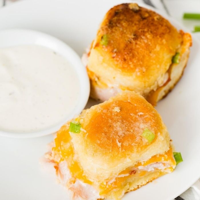 turkey sliders by dip on a plate 