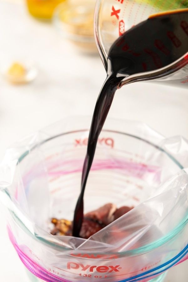 soy sauce pouring in a sealable bag