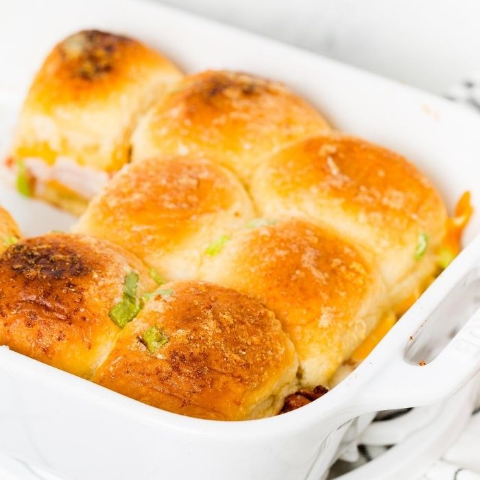 turkey sliders in pan with a few taken out