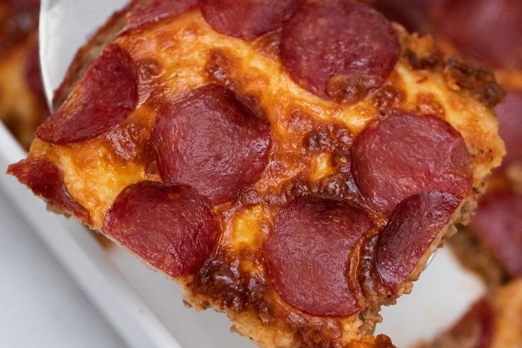 slice of keto pizza in pan