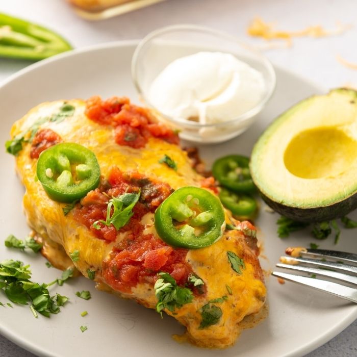 chicken on plate with avocado