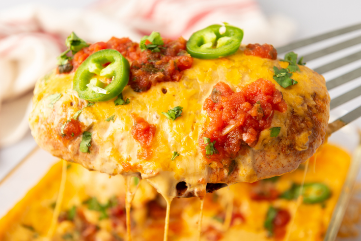 cheesy chicken being scooped up