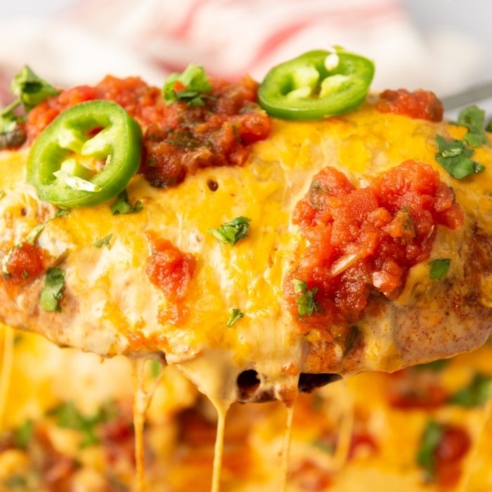 cheesy chicken scooped up in spatula 