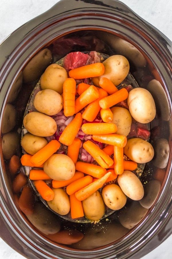 crockpot beef roast with potatoes and carrots on top