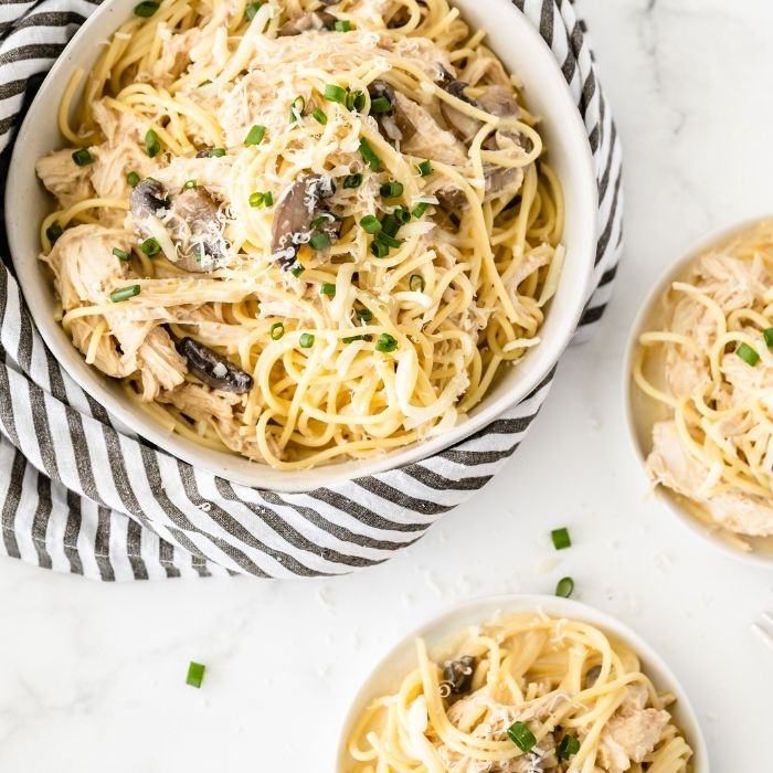 chicken pasta in bowls on table