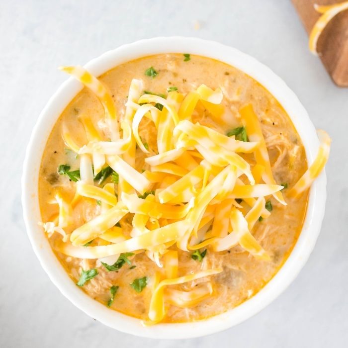 green chili soup topped with cheese