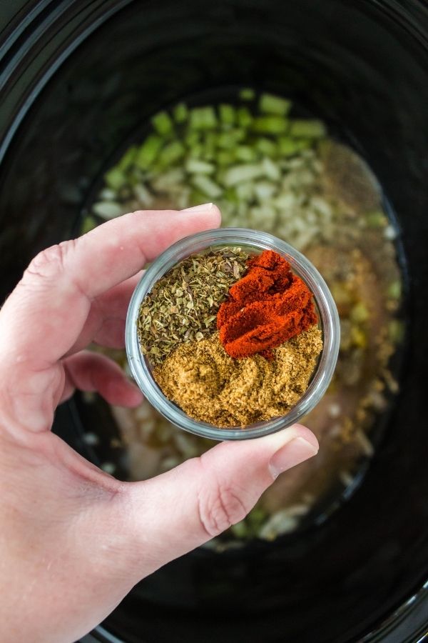 spices in a bowl above slow cooker