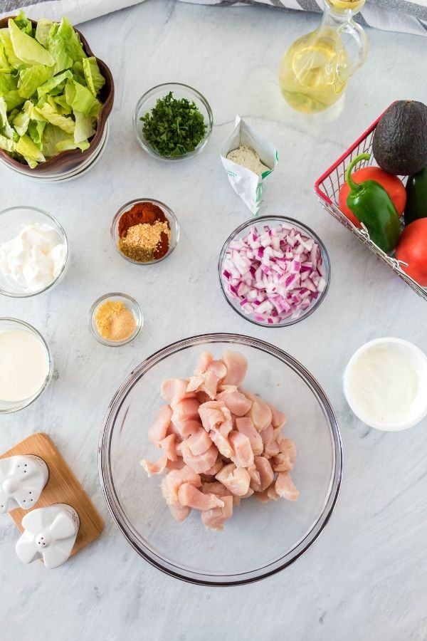 taco chicken salad ingredients on a table