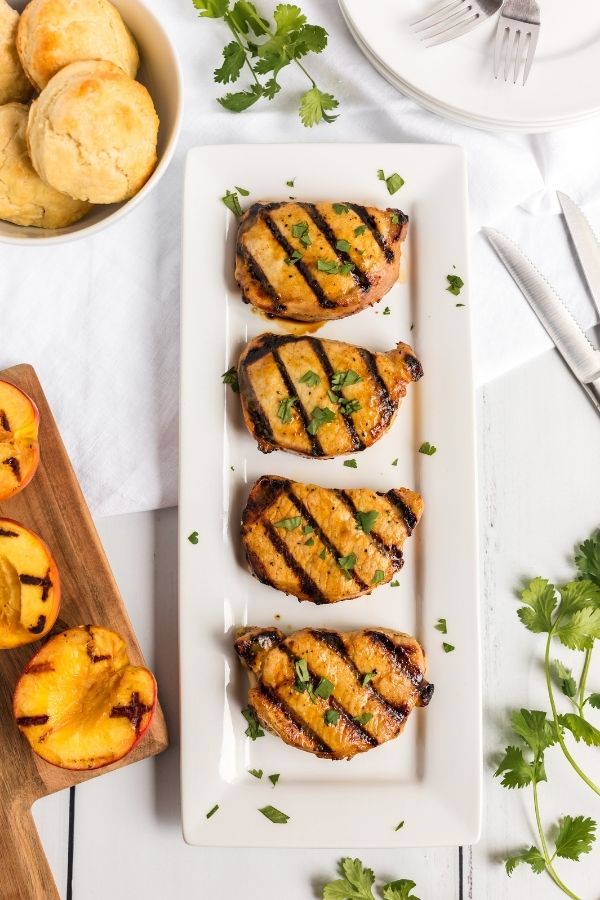 rectangle platter with pork chops on it