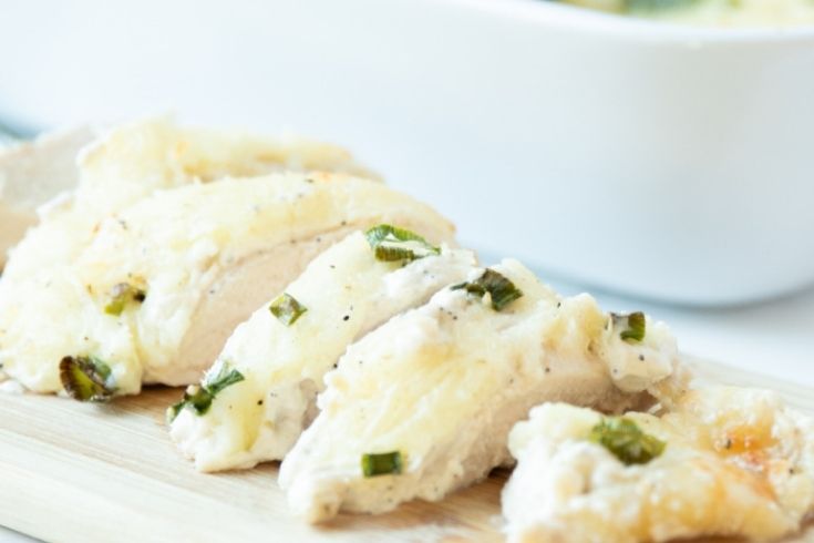 caesar chicken on wooden cutting board