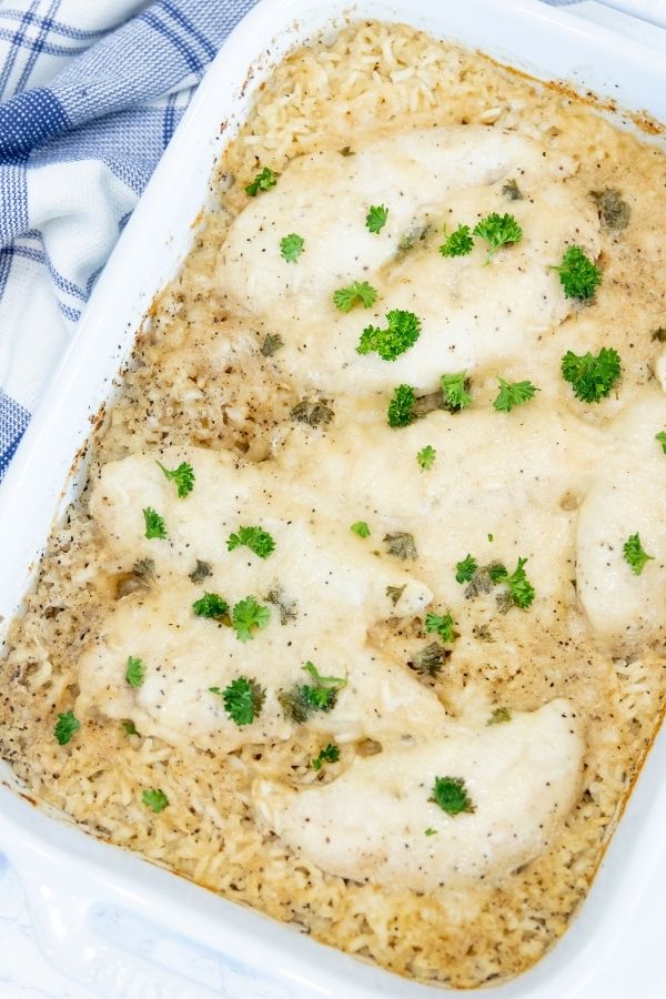 dinner casserole in a casserole pan with parsley on top 