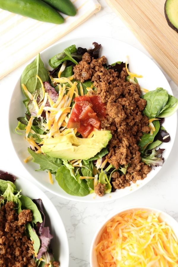 taco salads in a bowl with cheese in a bowl on 
