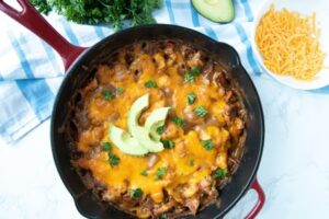 fajita skillet topped with avocados