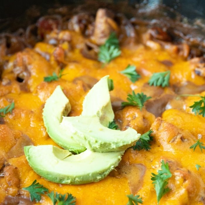 cheesy chicken casserole with avocado on top 