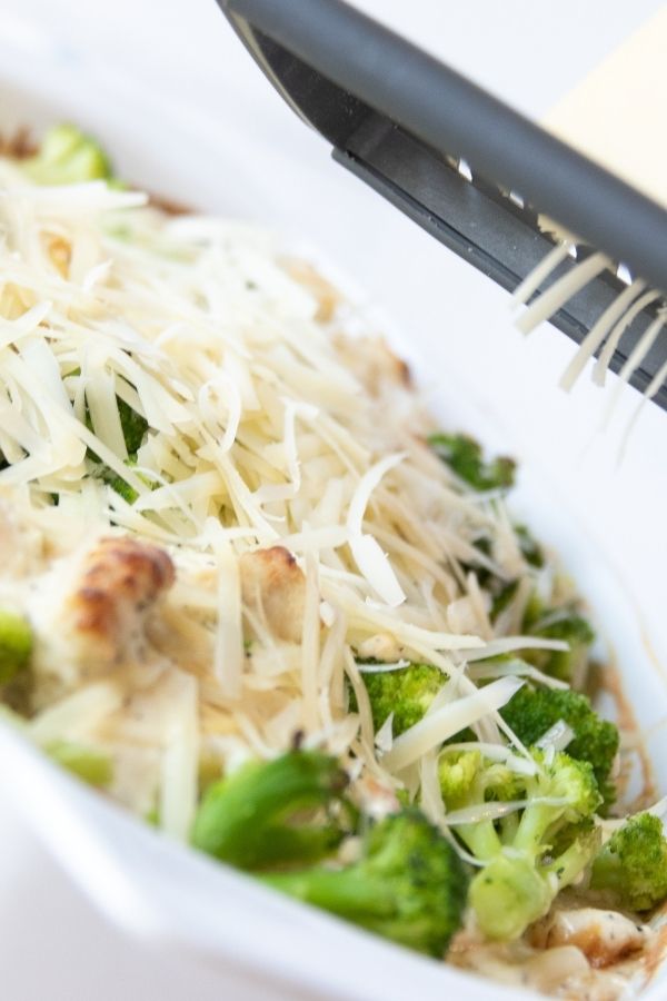 chicken alfredo broccoli with cheese grating on top 