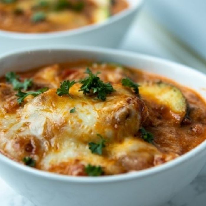 close up view of lasagna in a bowl 