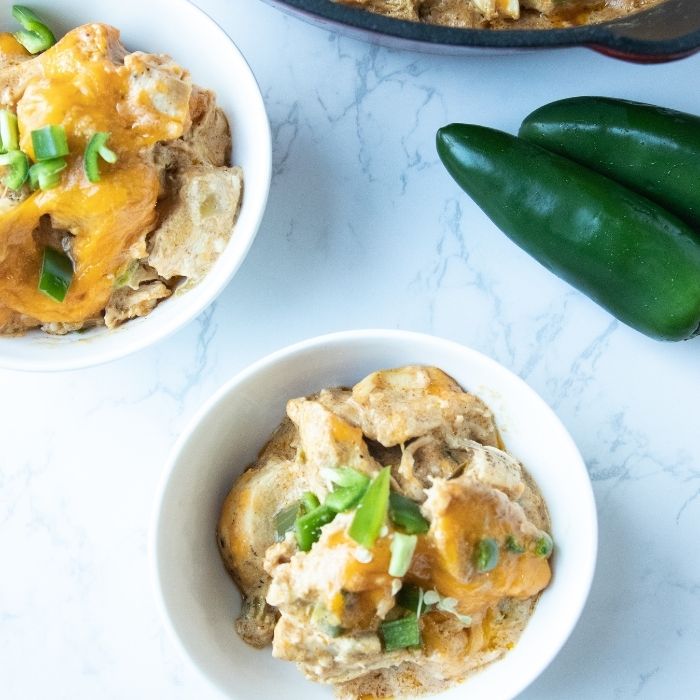 bowls of chicken casserole with peppers by it 