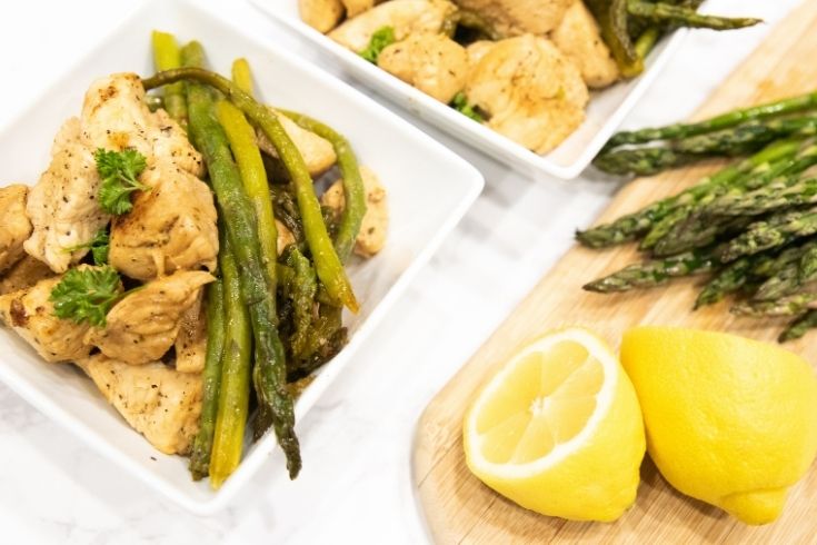 chicken and asparagus on plates