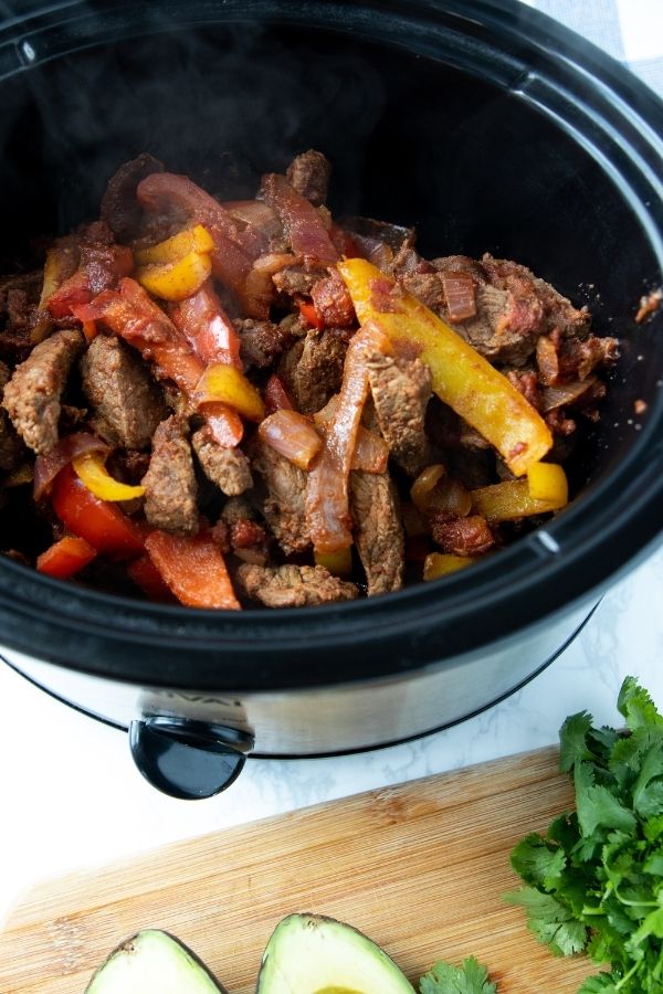 crock pot with steak fajita mix in it