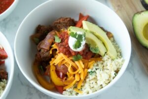 steak fajita bowl topped with tons of toppings