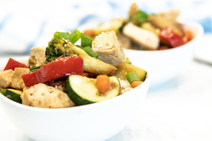 bowls of chicken and veggies with teriyaki sauce